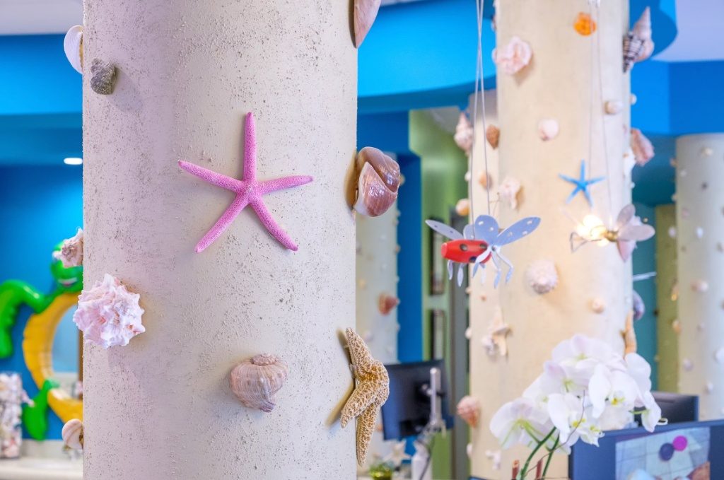 Seashell-and-starfish columns in the CarlsbaDDS Pediatric Smiles reception