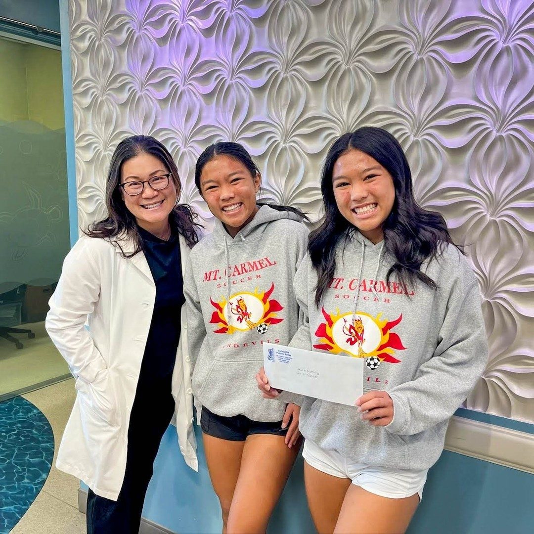 Dr. Linh Tsai with two teen patients at CarlsbaDDS Pediatric Smiles