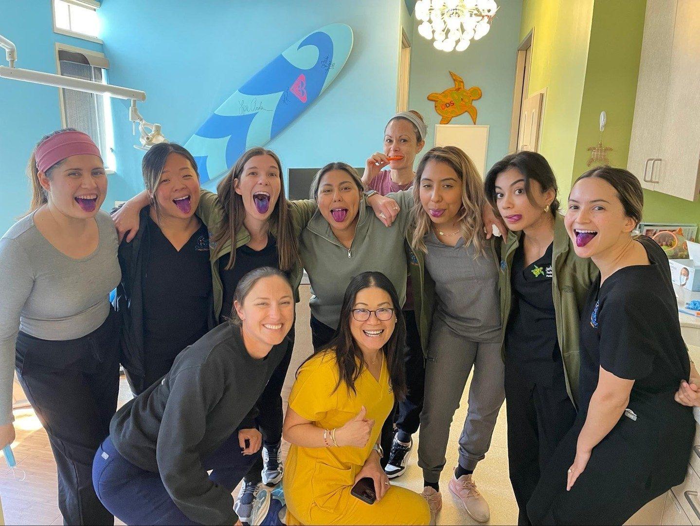 The team sharing a playful moment together in a treatment room