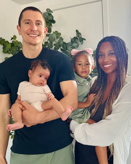 Dr. Najwa Howard, back at the practice, with her husband, their daughter and new baby Selah
